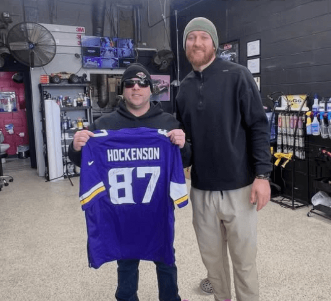 Professional athlete at Doctor Detail with signed jersey