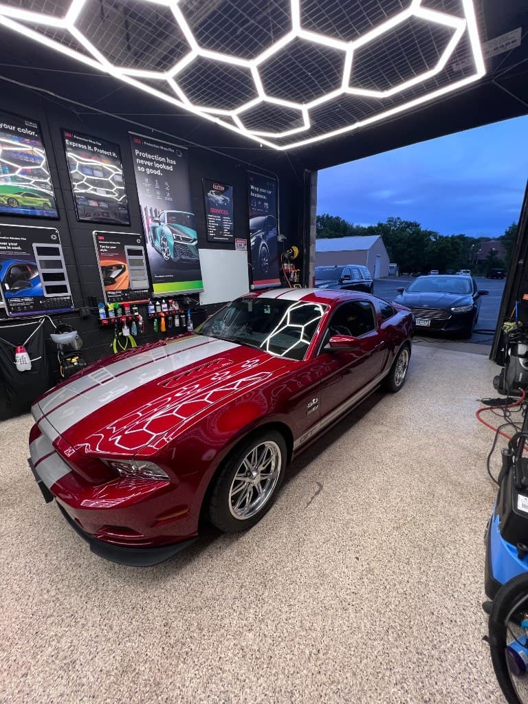 Red Ford Mustang GT in Doctor Detail shop — Eagan MN