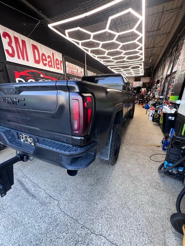 Matte black GMC Sierra in Doctor Detail shop — Eagan MN