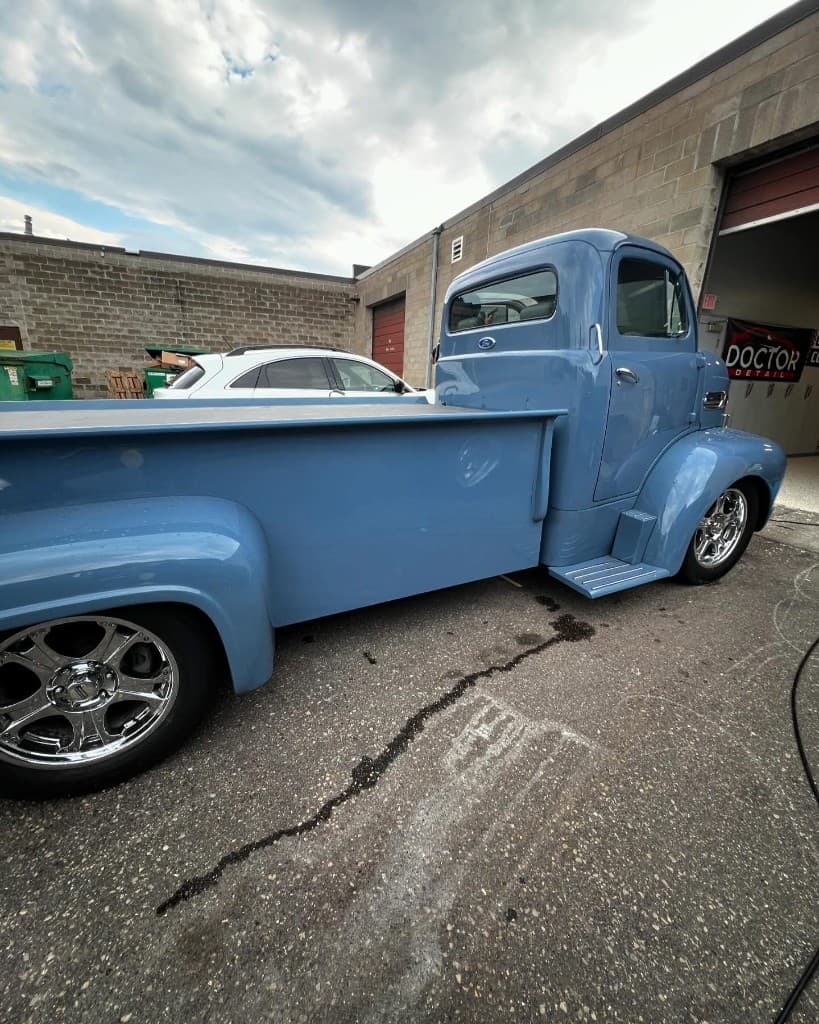 Light blue vintage Ford pickup at Doctor Detail shop — Eagan MN
