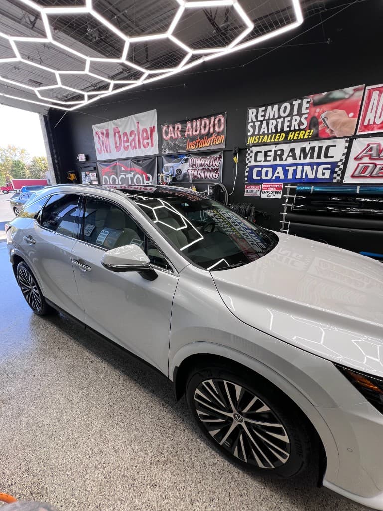 White Lexus SUV in Doctor Detail shop — Eagan MN